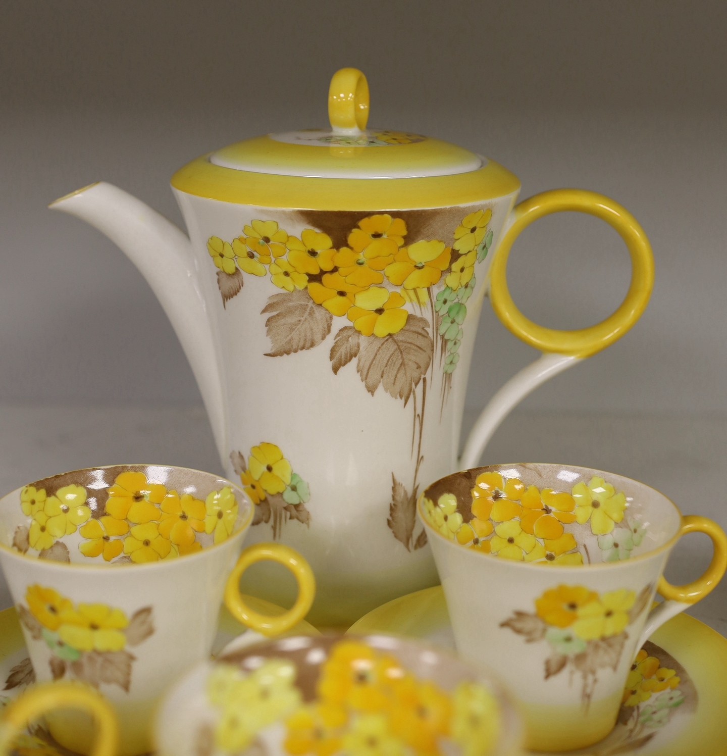 A Shelley “Yellow Phlox”, part tea service, one cup missing and one cup cracked